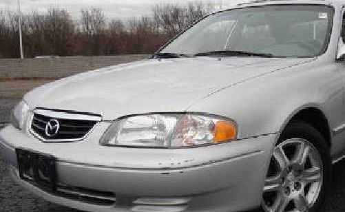 Police are looking for the driver of a 2001 silver Mazda 626 sedan similar to this one. Police are looking for the driver of a 2001 silver Mazda 626 sedan similar to this one.